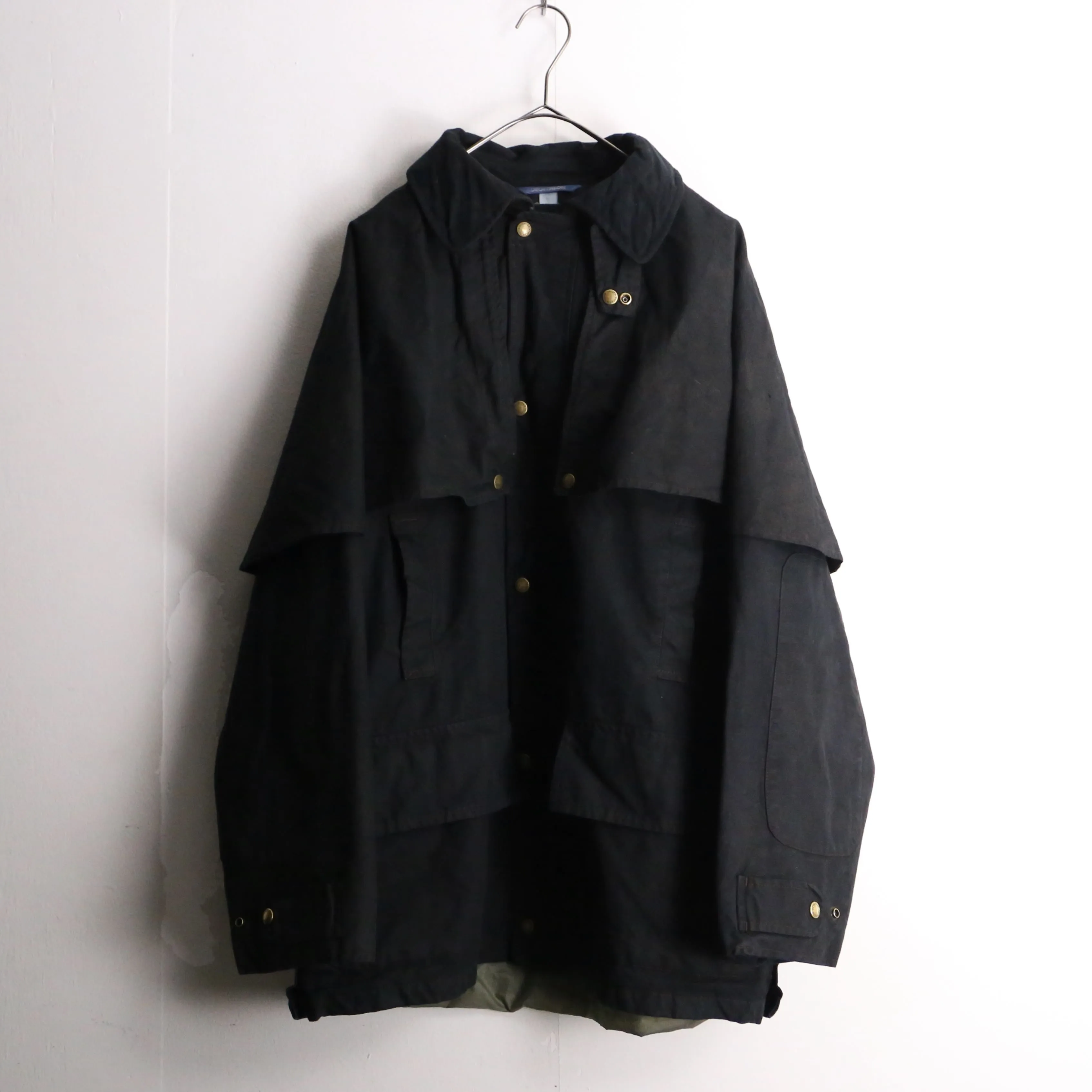 black cape design oiled jacket