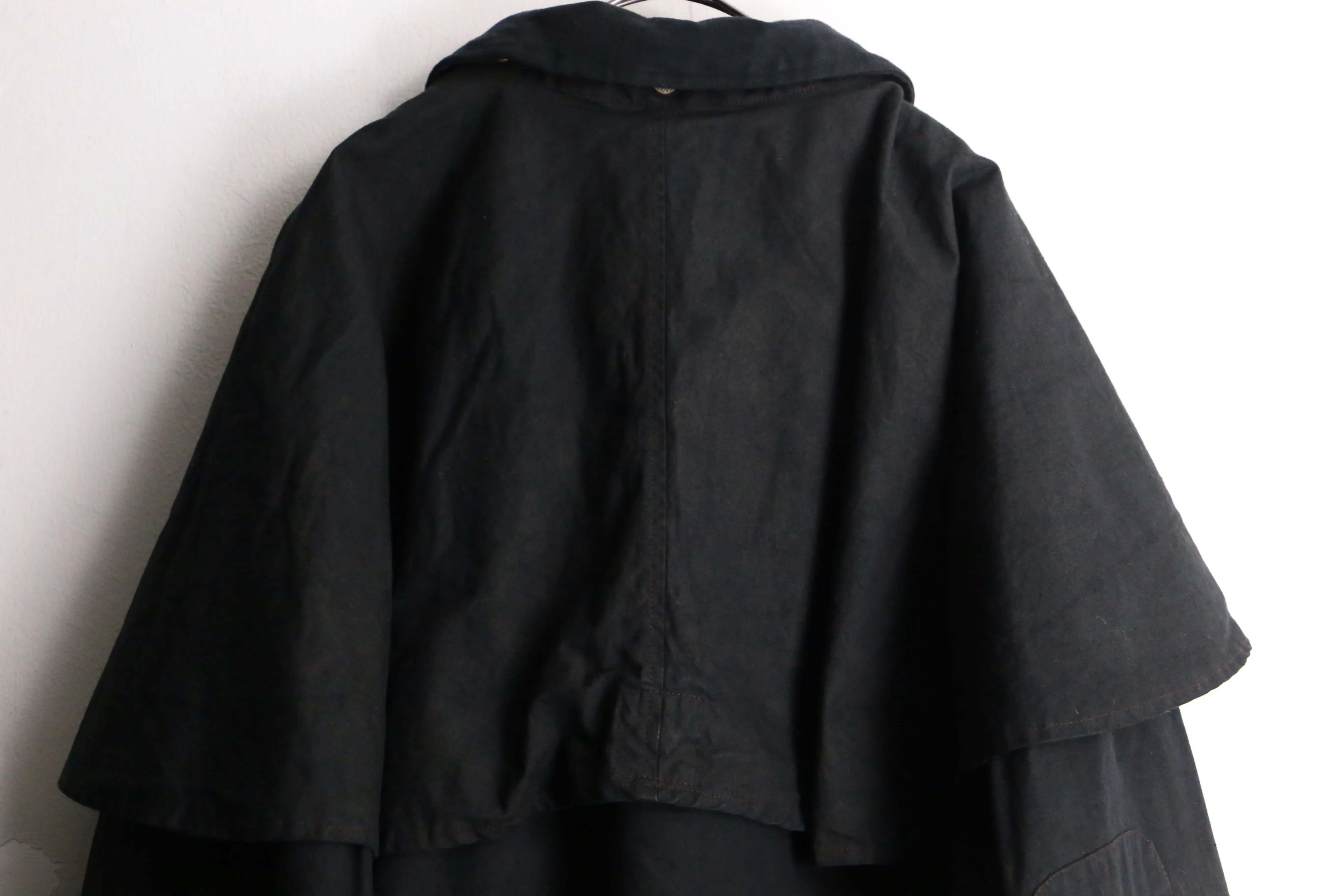 black cape design oiled jacket