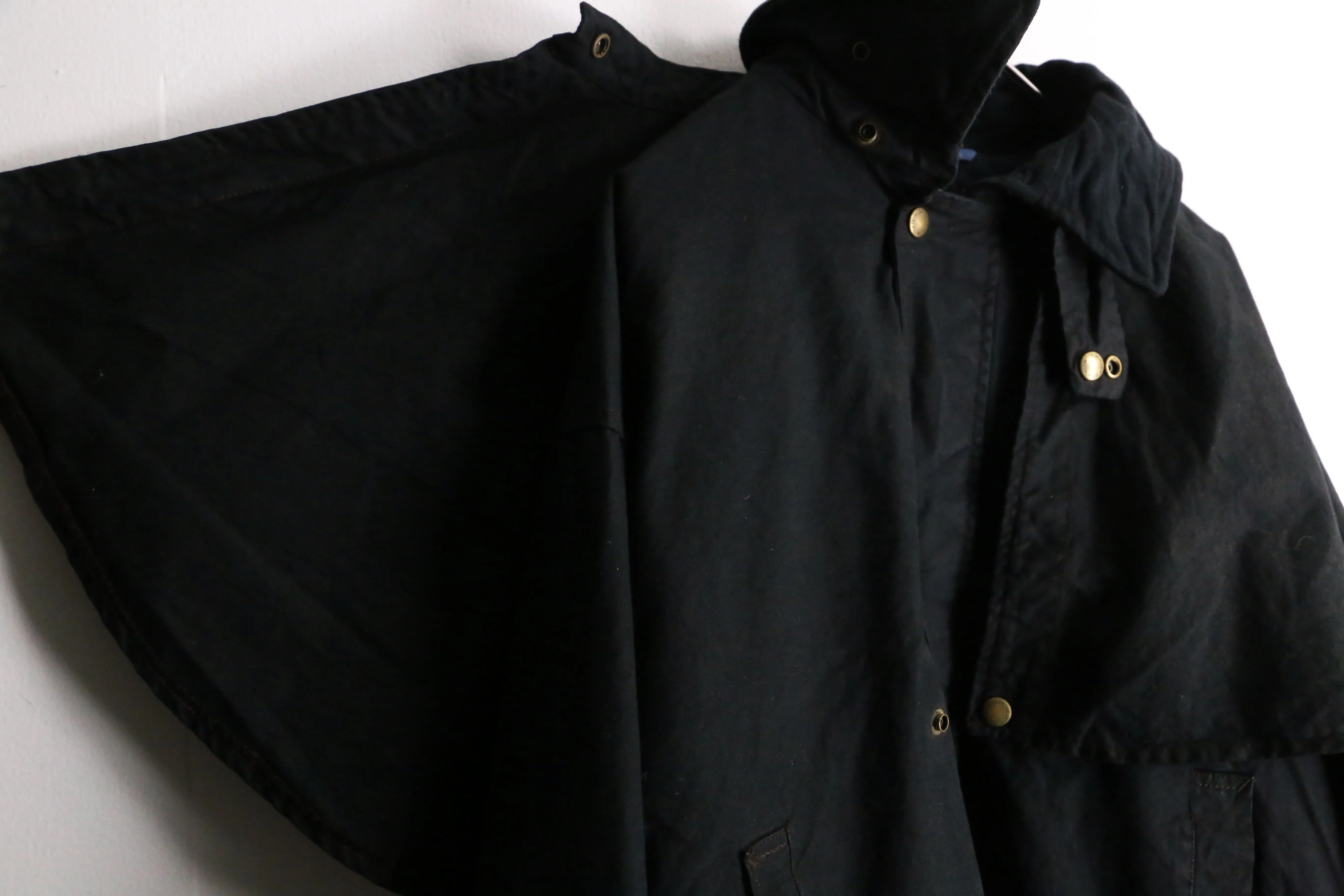 black cape design oiled jacket